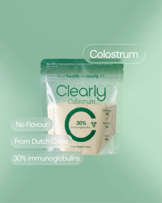 Clearly Colostrum supplement bottle with label visible, showing the front label and product details.
